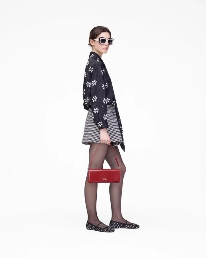 Blusa con lazo y ojales Trompe L’Oeil