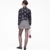Blusa con lazo y ojales Trompe L’Oeil