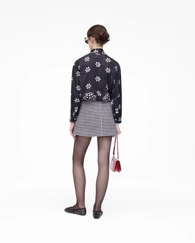 Blusa con lazo y ojales Trompe L’Oeil