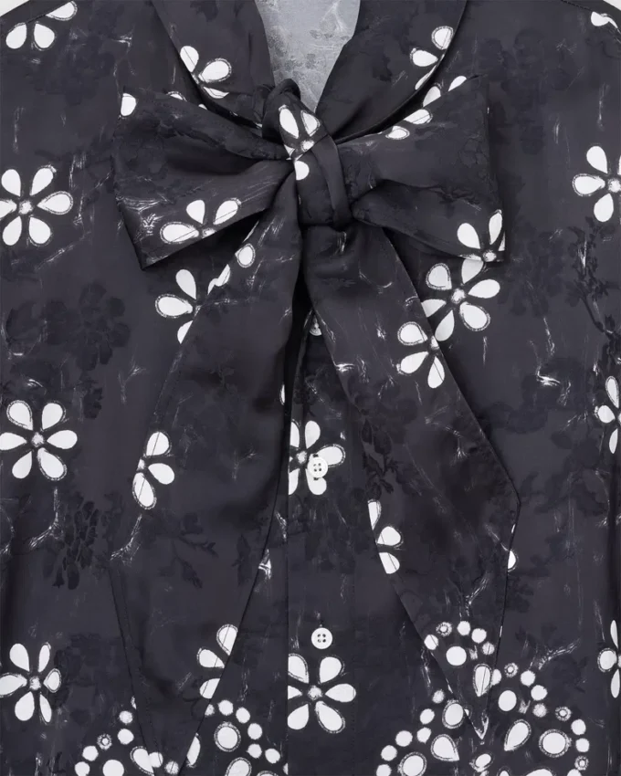 Blusa con lazo y ojales Trompe L’Oeil