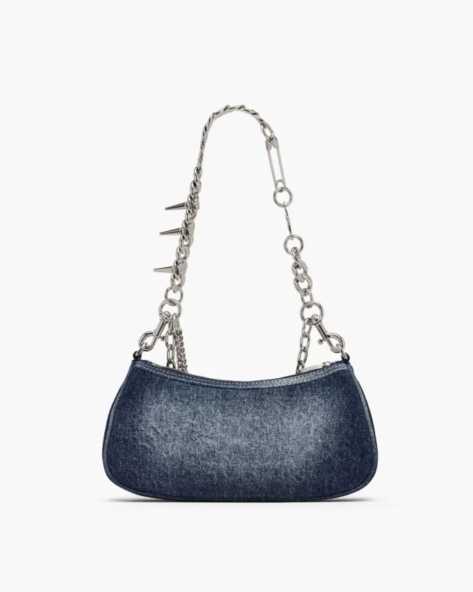 Bolso bandolera con charm de denim desgastado