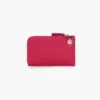 Cartera con cremallera superior y charms