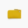 Cartera con cremallera superior y charms