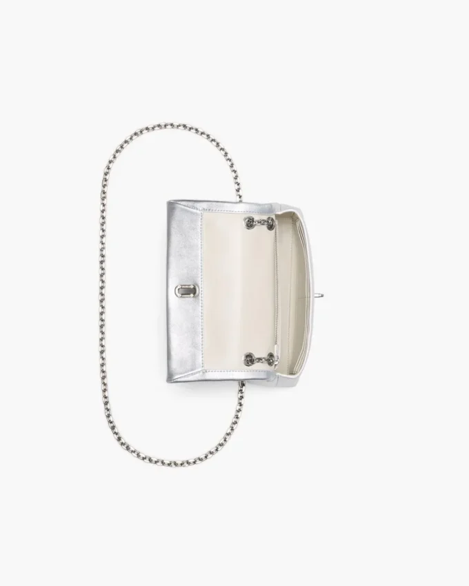 El bolso mini con doble cadena metálica El bolso mini con doble cadena metálica