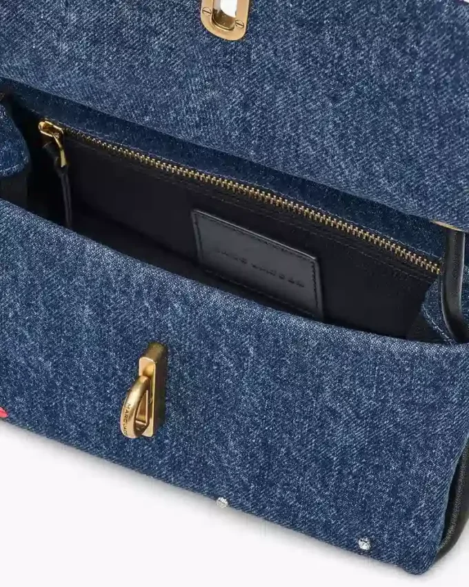 El bolso mini dual de denim con charms