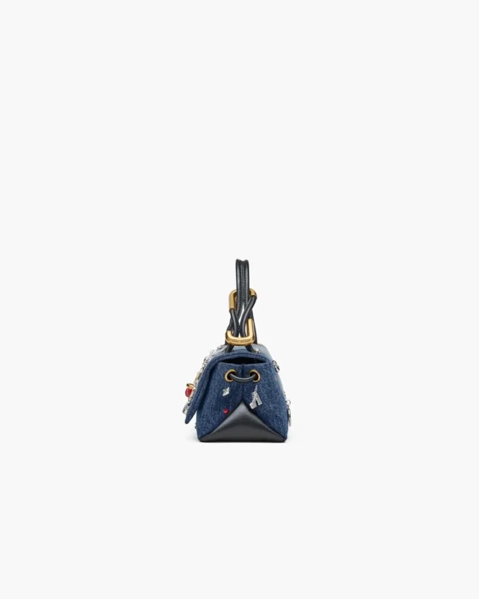 El bolso mini dual de denim con charms