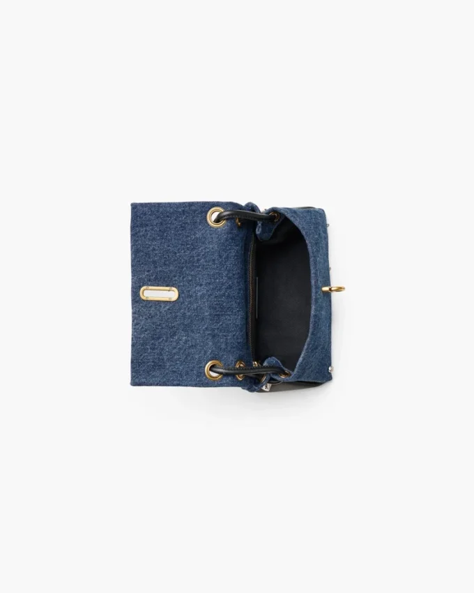 El bolso mini dual de denim con charms