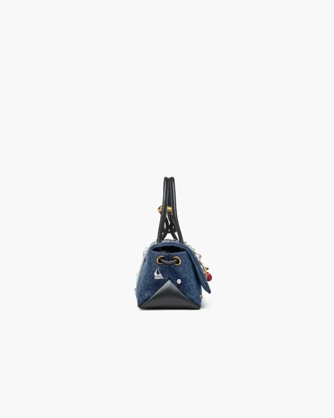 El bolso mini dual de denim con charms