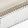 El mini bolso con cadena de cuero metalizado El mini bolso con cadena de cuero metalizado