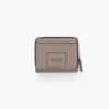 La mini cartera compacta de cuero